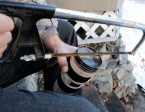 Salmon Arm, BC - Steps to remove a stuck lens filter: #1. Use hacksaw to cut rim of the filter down to the glass.