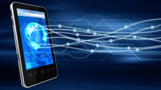 telstra employee enjoying 4g lte speeds by the beach