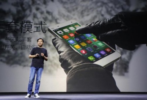 Lei Jun, founder and CEO of China's mobile company Xiaomi Inc, introduces the new features of Xiaomi Phone 4 at its launching ceremony, in Beijing